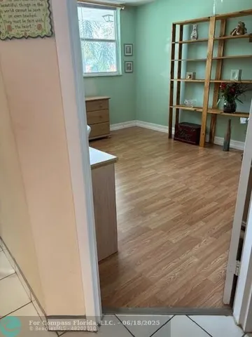 a living room with a furniture and a window