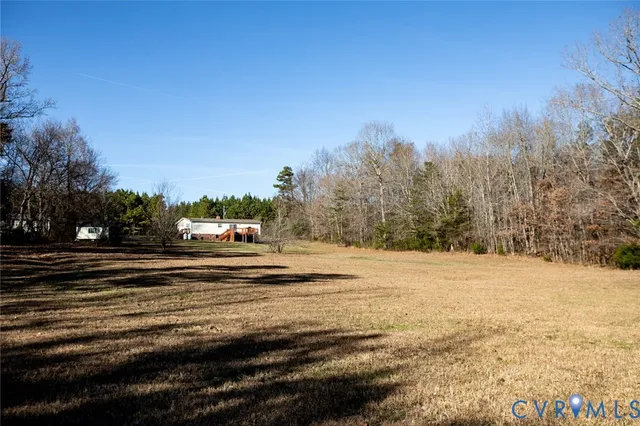 a view of a town with big trees