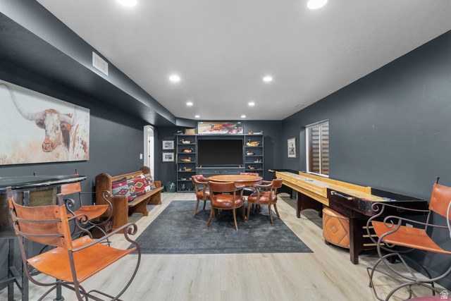 886 River Ridge Lane Spanish Fork, UT 84660 - Photo 16 of 31 Recessed lighting, light wood-finish flooring, built-in shelving, dark-painted walls, and a window with horizontal blinds