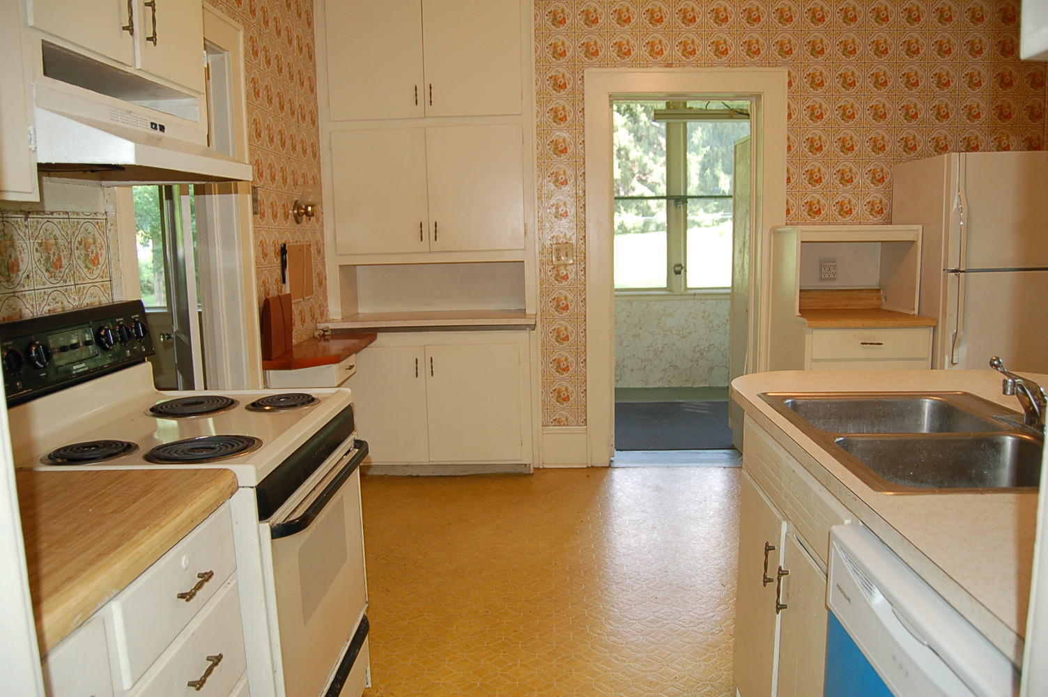 48 Fields Avenue Blue Ridge, VA 24064 - Photo 16 of 46 a kitchen that has a sink a stove and a refrigerator