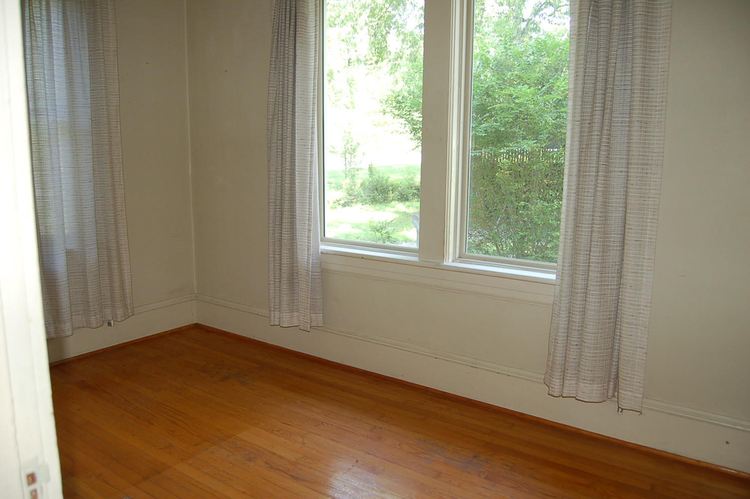 48 Fields Avenue Blue Ridge, VA 24064 - Photo 20 of 46 an empty room with wooden floor and windows