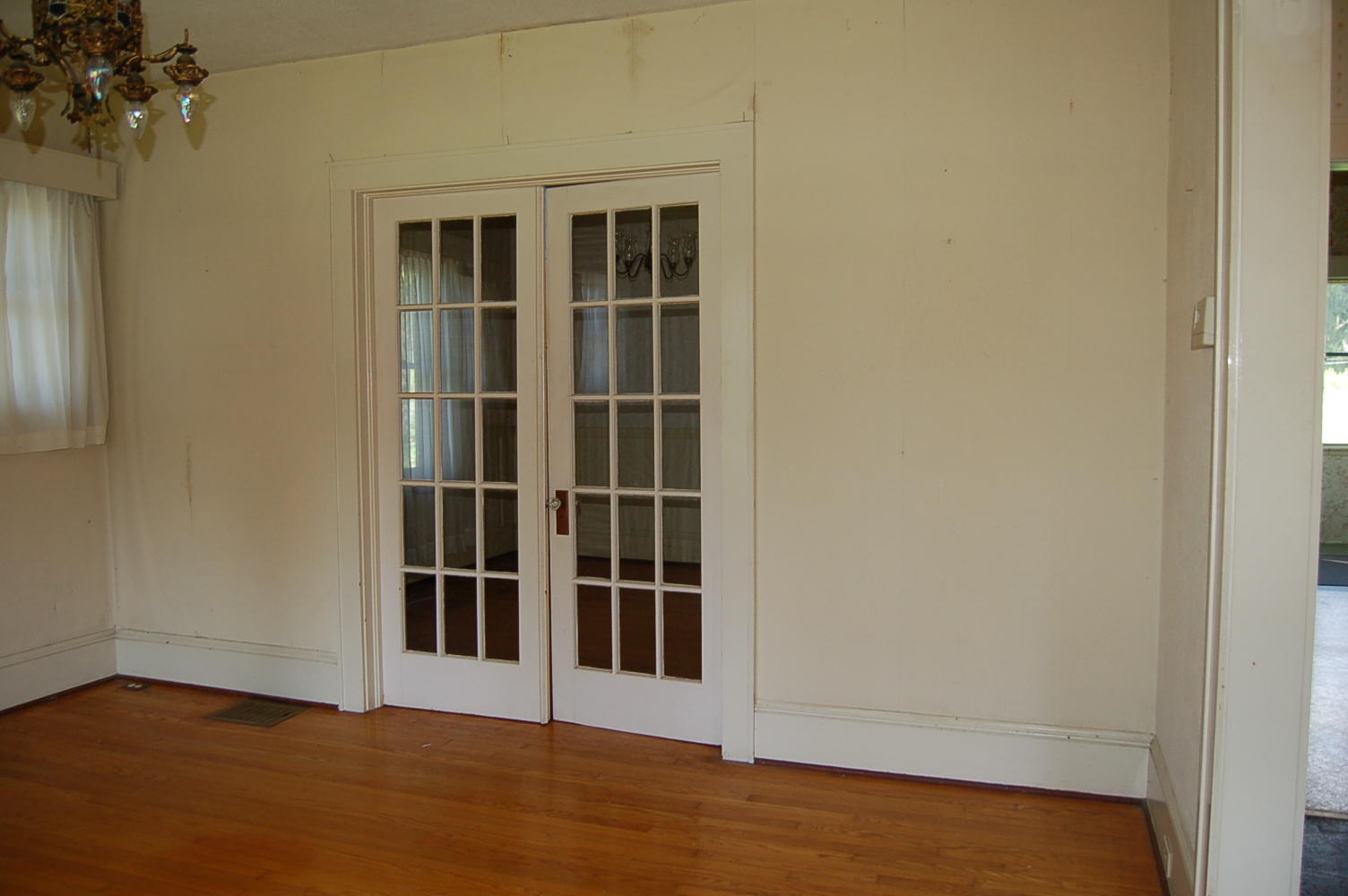 48 Fields Avenue Blue Ridge, VA 24064 - Photo 6 of 46 an empty room with wooden floor and a window