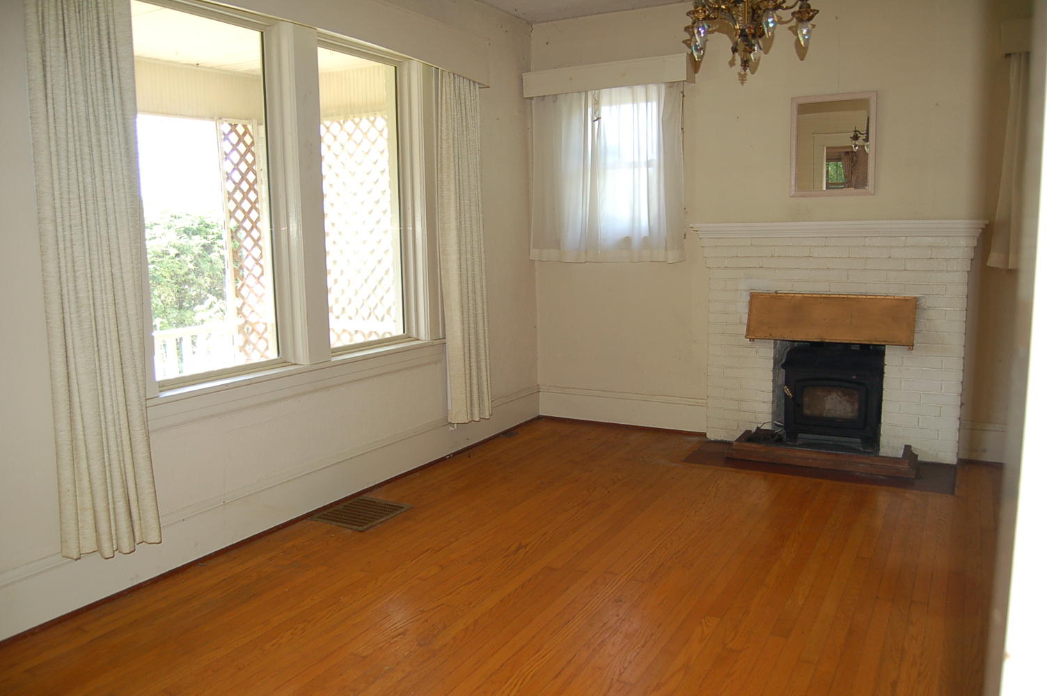 48 Fields Avenue Blue Ridge, VA 24064 - Photo 7 of 46 an empty room with windows and fireplace