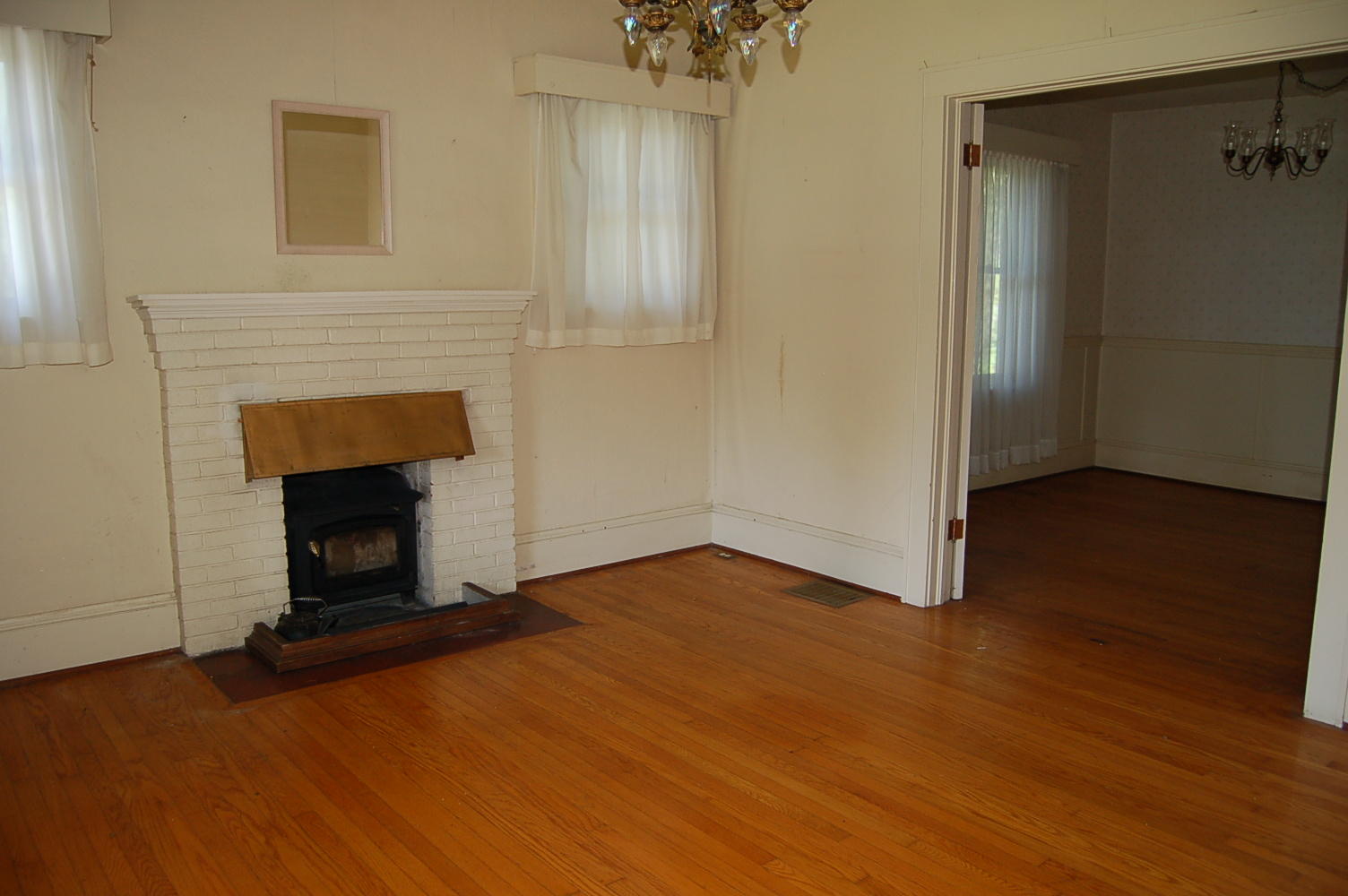 48 Fields Avenue Blue Ridge, VA 24064 - Photo 8 of 46 a view of empty room with wooden floor and fireplace
