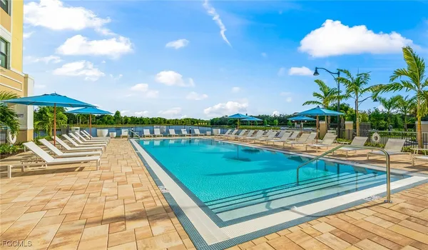 a view of swimming pool with a lounge chair