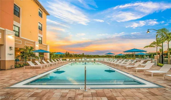 a view of a swimming pool with a lounge chairs