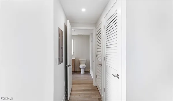 a view of a hallway with a white walls