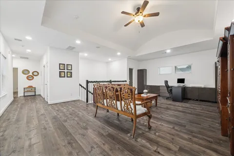a living room with furniture and kitchen view