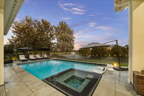 a view of swimming pool from a balcony