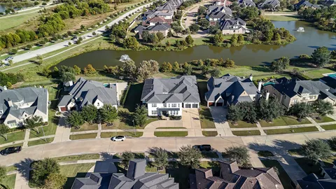 an aerial view of a house with lake view