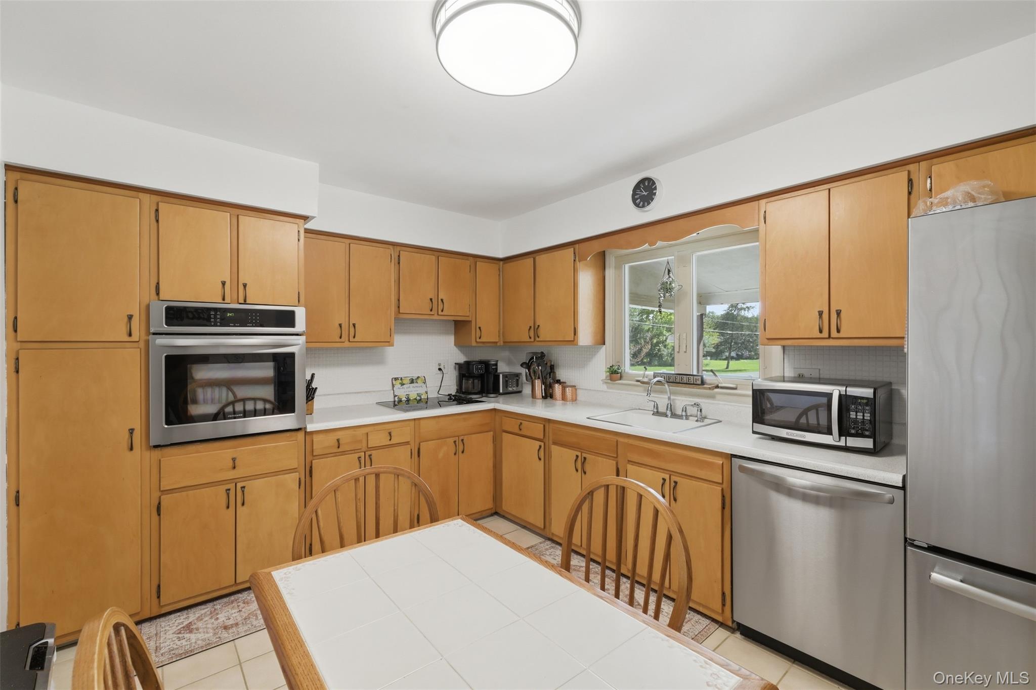 24 Beatty Road Wappingers Falls, NY 12590 - Photo 10 of 36 a kitchen with granite countertop a sink stainless steel appliances and cabinets