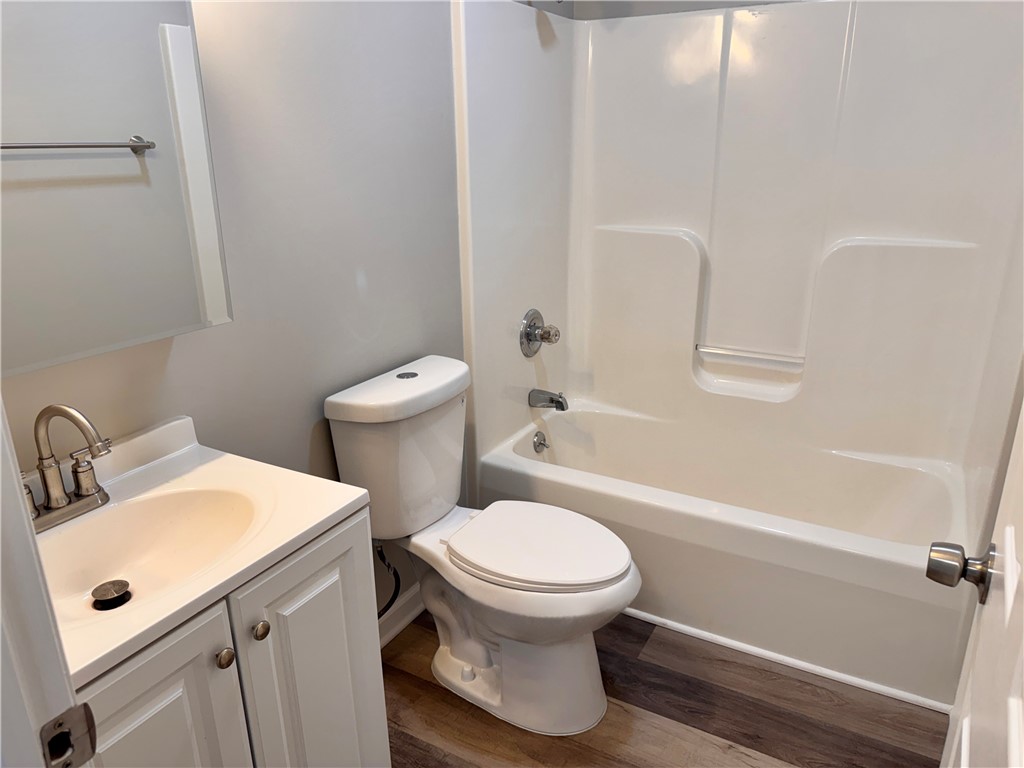 1118 Wedgewood Court Decatur, IL 62526 - Photo 19 of 22 a white toilet sitting next to a bathroom sink
