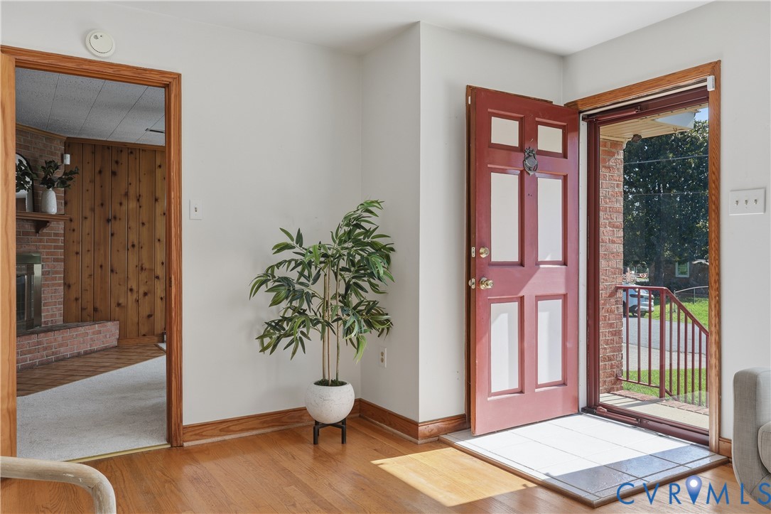 5210 Ronson Road North Chesterfield, VA 23234 - Photo 4 of 35 Red panel door entry with a storm door, wood-finis