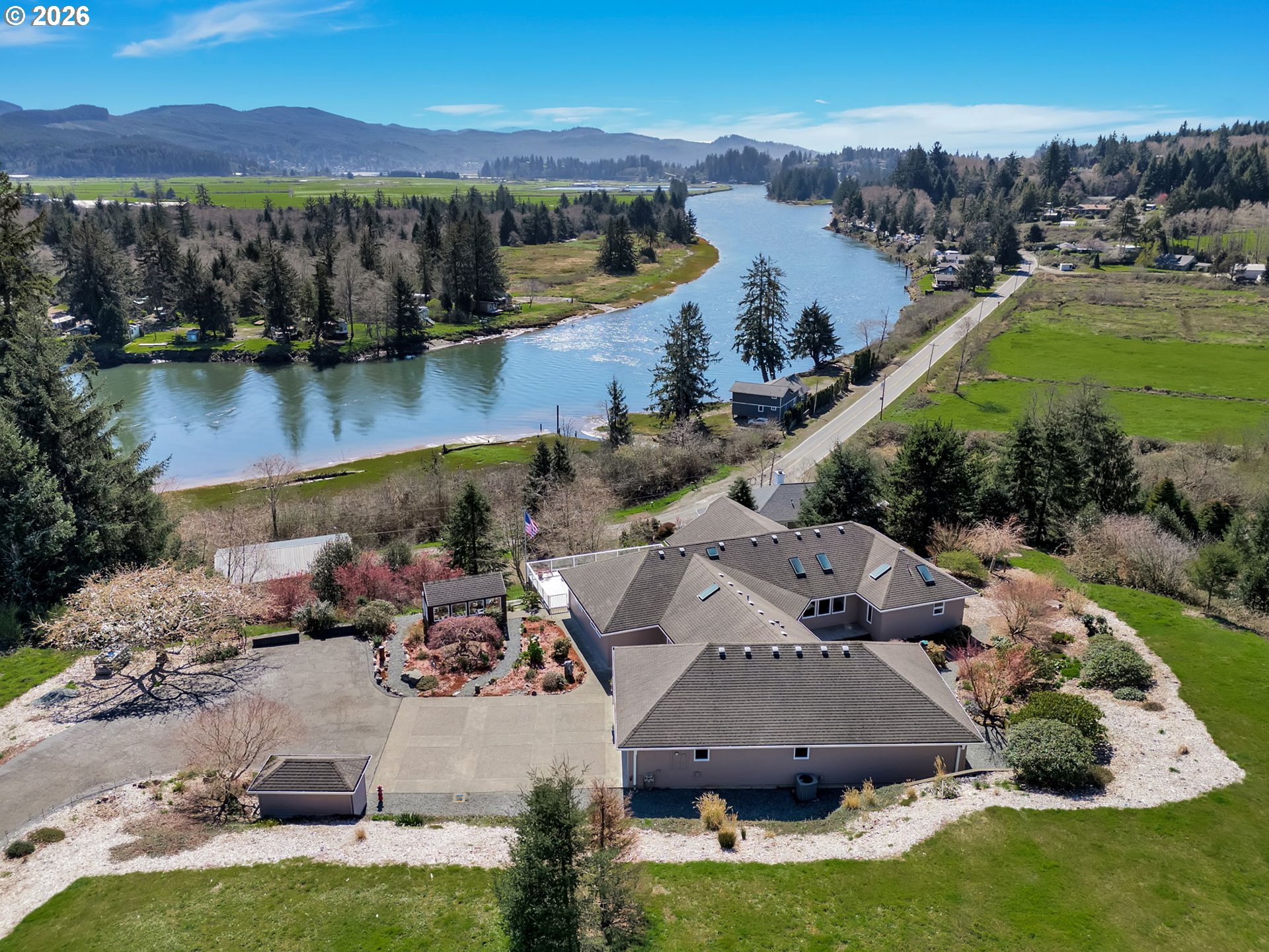 14115 Riverview Meadows Lane Nehalem, OR 97131 - Photo 1 of 39 an aerial view of residential houses with outdoor space and river