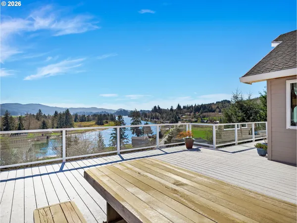 a view of a roof deck with chair and wooden floor