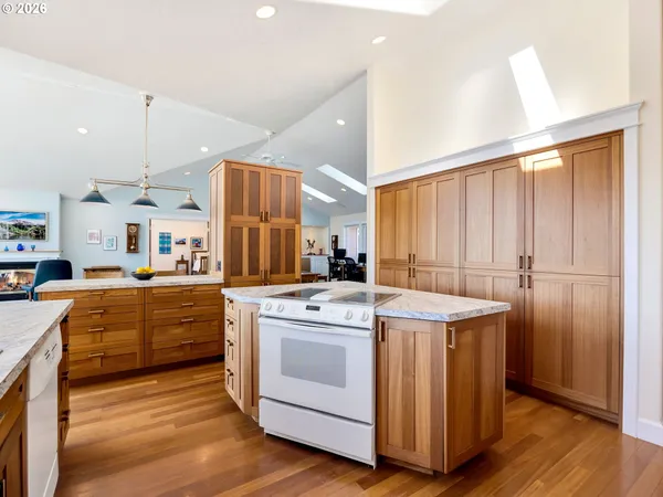 a kitchen with a stove a sink and a refrigerator
