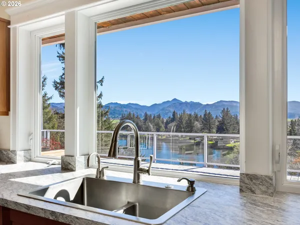 a view of a sink and a window
