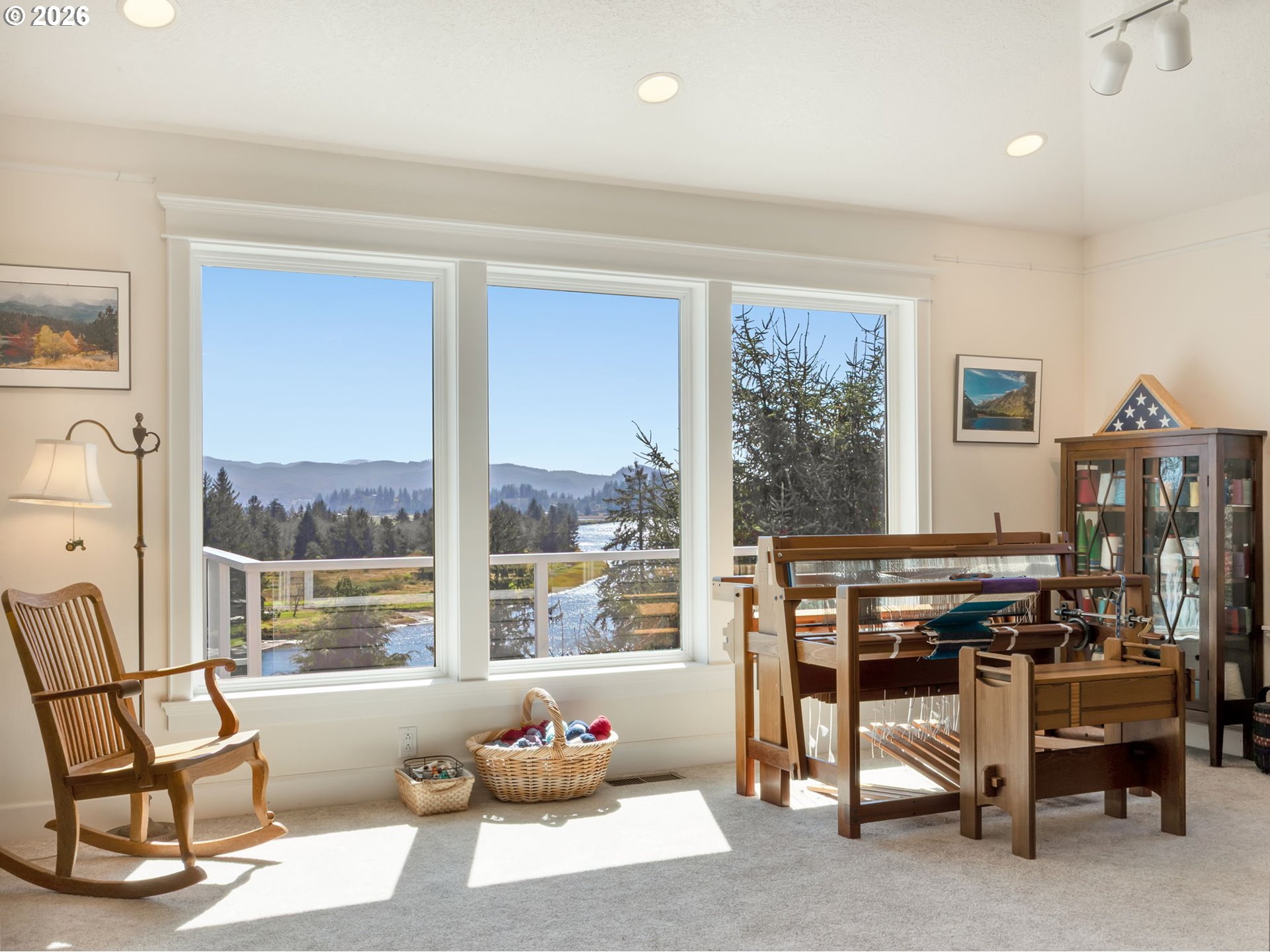 14115 Riverview Meadows Lane Nehalem, OR 97131 - Photo 22 of 39 a view of a livingroom with furniture and a floor to ceiling window