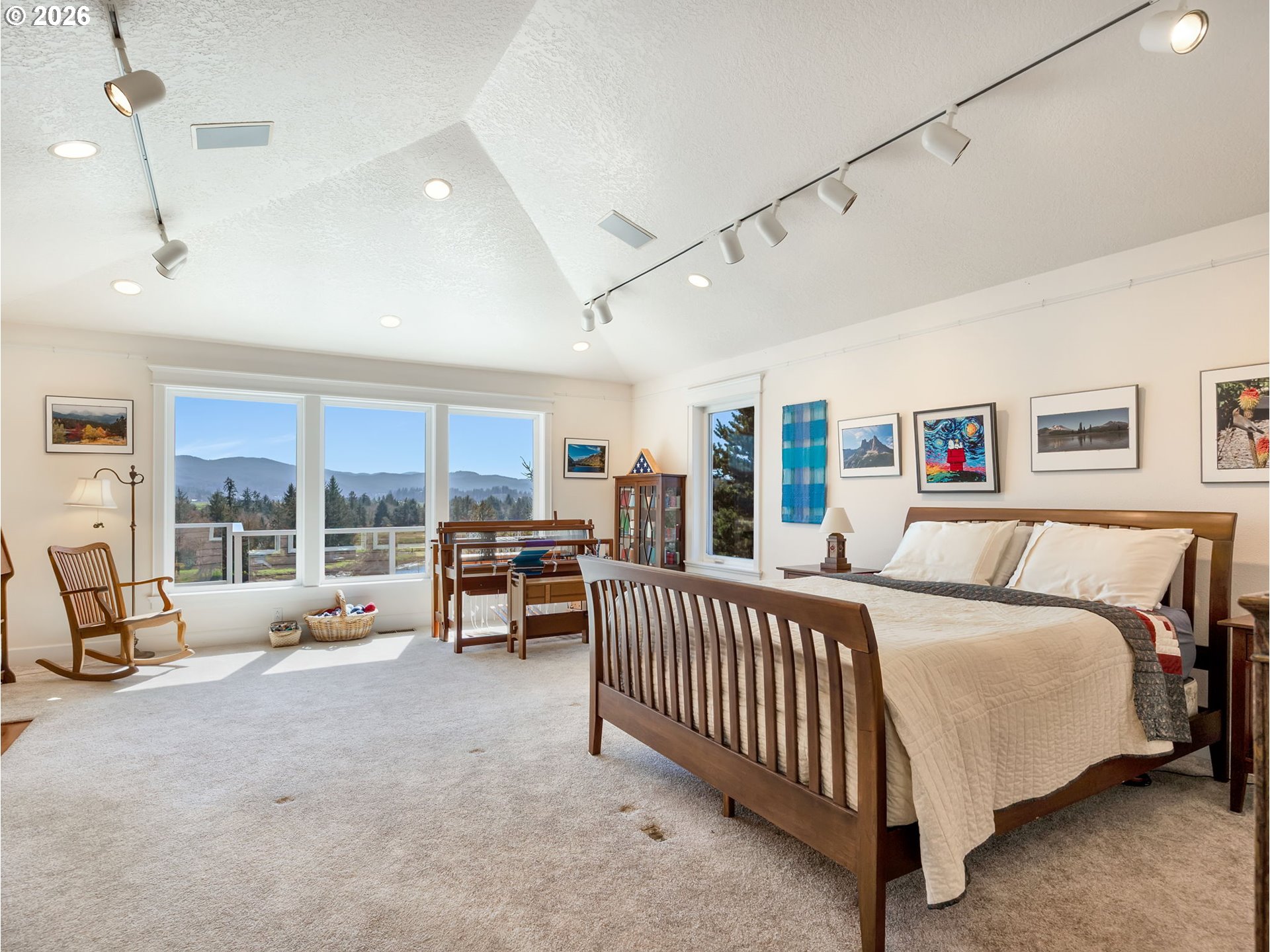 14115 Riverview Meadows Lane Nehalem, OR 97131 - Photo 23 of 39 a bedroom with furniture and a large window