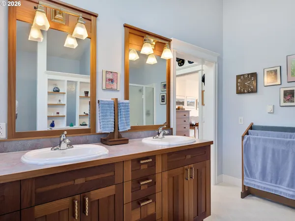 a bathroom with a sink double vanity and a mirror