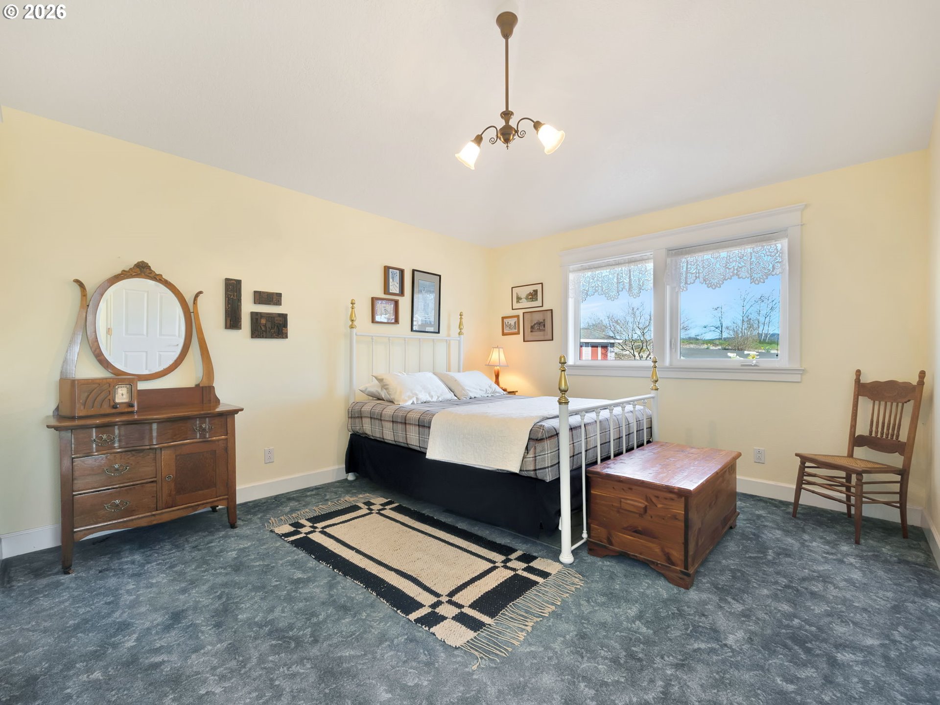 14115 Riverview Meadows Lane Nehalem, OR 97131 - Photo 29 of 39 a bedroom with furniture and a window
