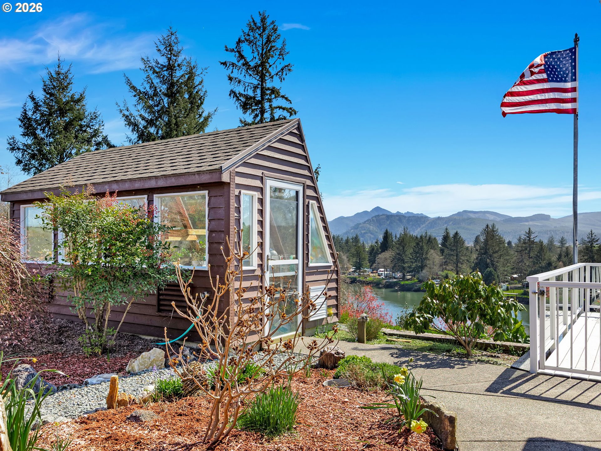 14115 Riverview Meadows Lane Nehalem, OR 97131 - Photo 34 of 39 a backyard of a house with lots of green space