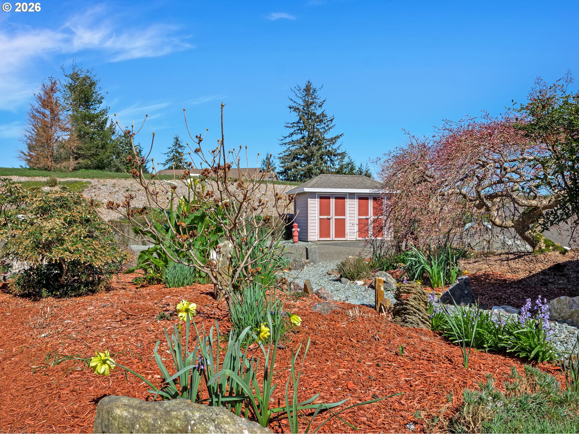 14115 Riverview Meadows Lane Nehalem, OR 97131 - Photo 35 of 39 a view of a garden with a house