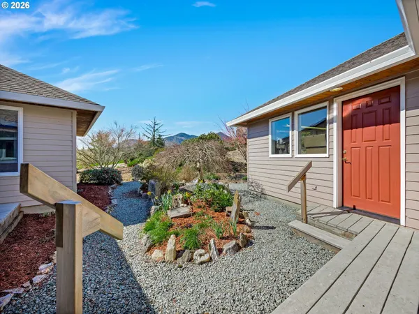 a view of a backyard with sitting area