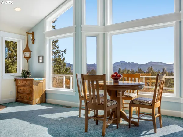 a view of a dining room with furniture window and outside view