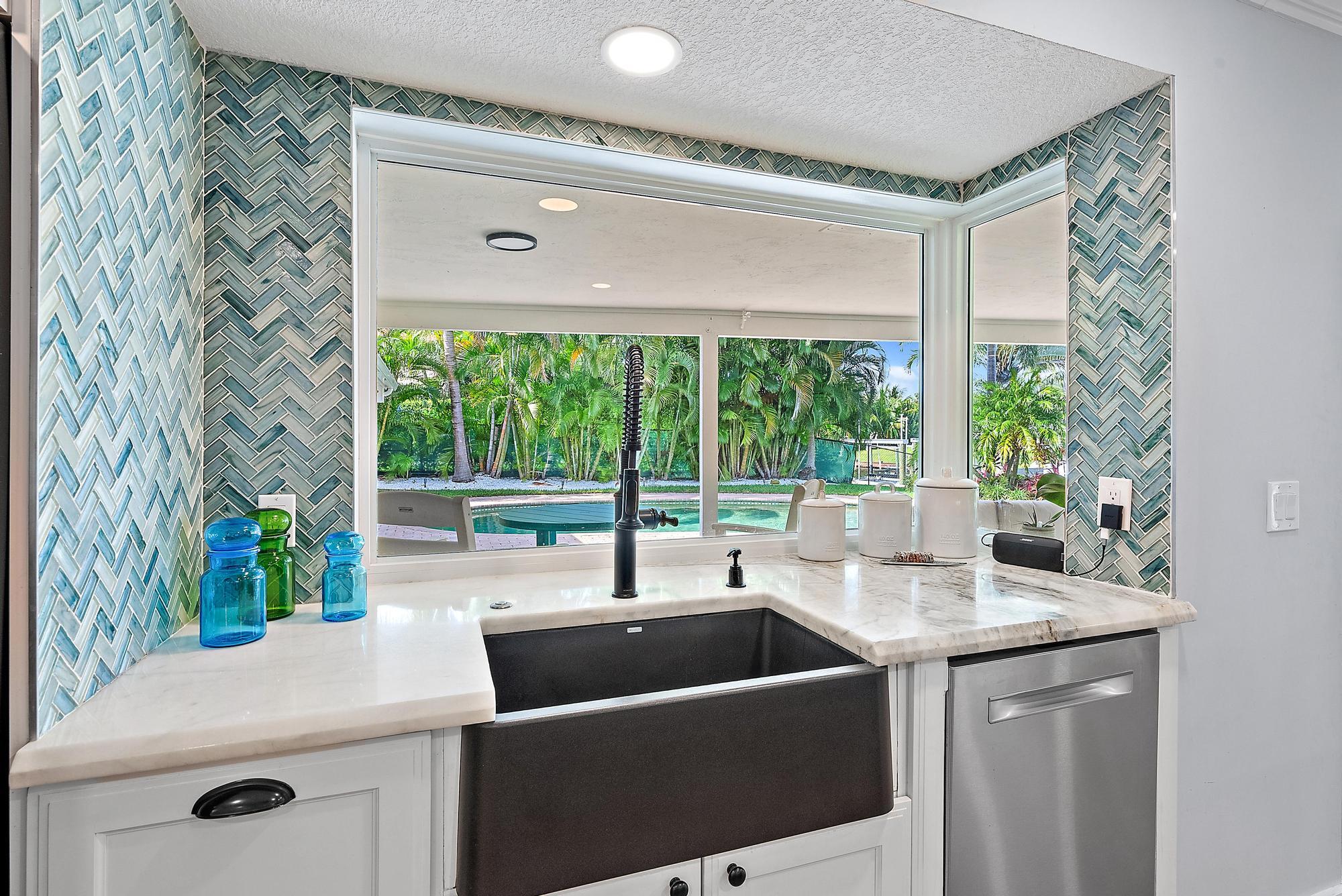 12821 Ellison Wilson Road North Palm Beach, FL 33408 - Photo 12 of 40 a kitchen with a sink and large window