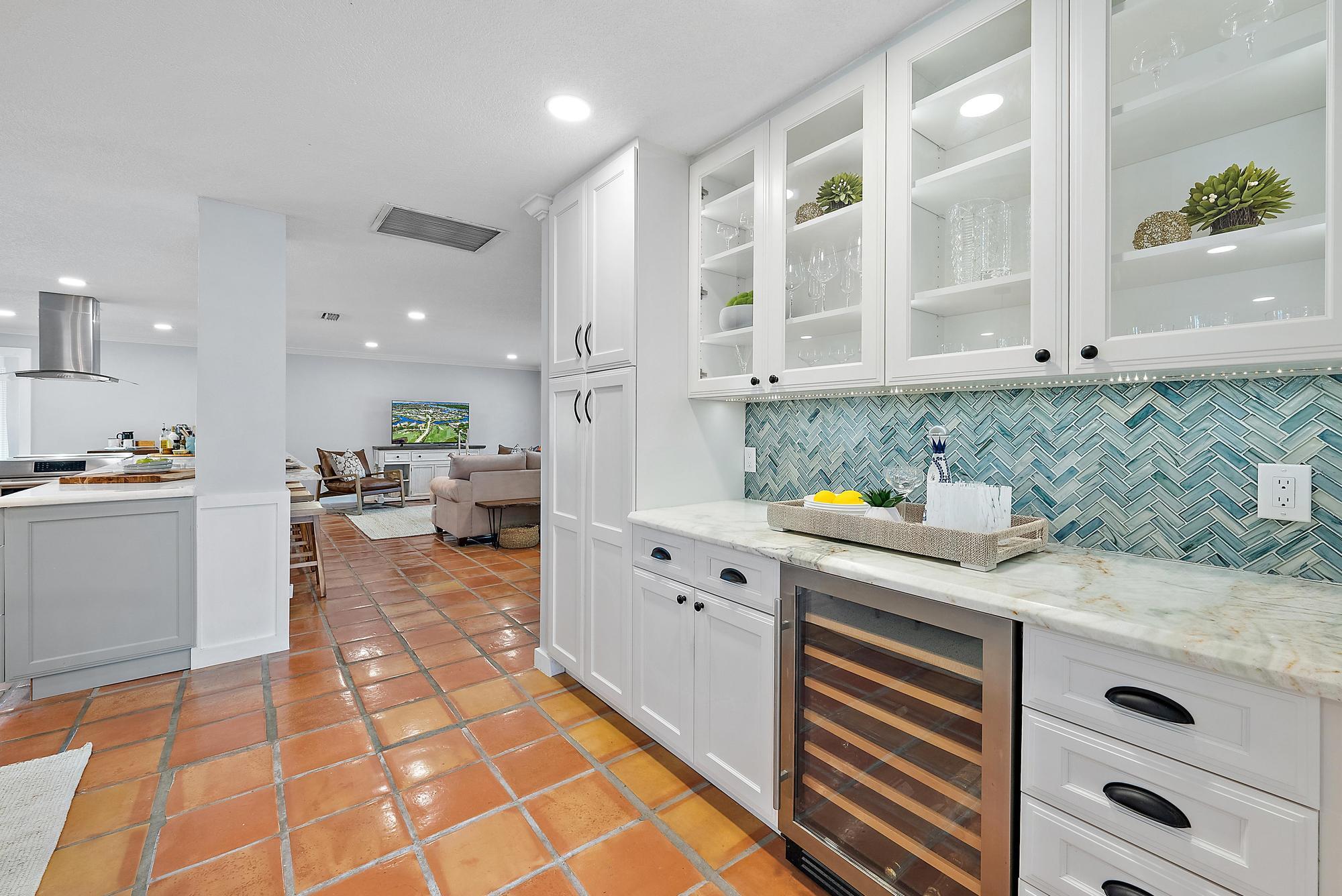 12821 Ellison Wilson Road North Palm Beach, FL 33408 - Photo 13 of 40 a kitchen with stainless steel appliances granite countertop a sink and cabinets