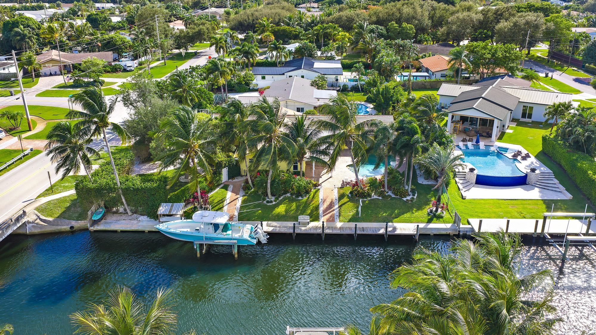 12821 Ellison Wilson Road North Palm Beach, FL 33408 - Photo 3 of 40 an aerial view of residential houses with outdoor space and swimming pool