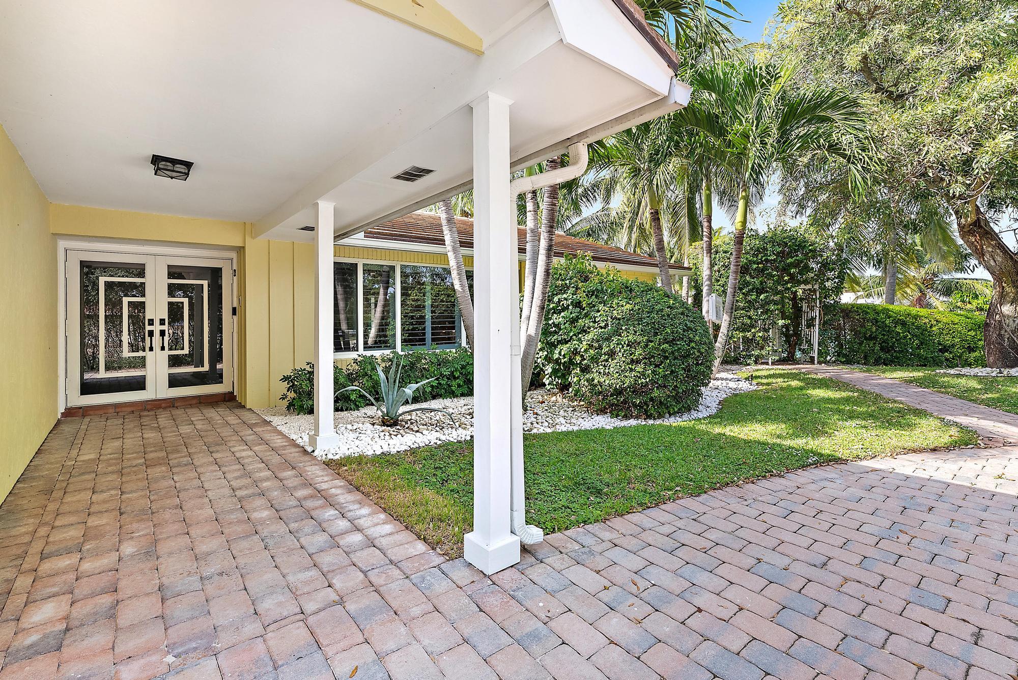 12821 Ellison Wilson Road North Palm Beach, FL 33408 - Photo 32 of 40 a view of a house with backyard and porch