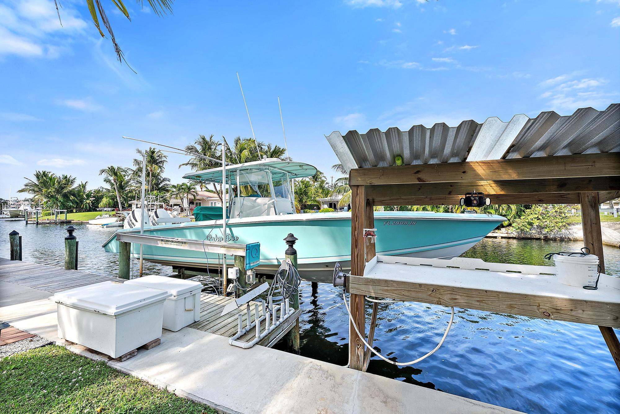 12821 Ellison Wilson Road North Palm Beach, FL 33408 - Photo 5 of 40 a view of a chairs and table in the patio
