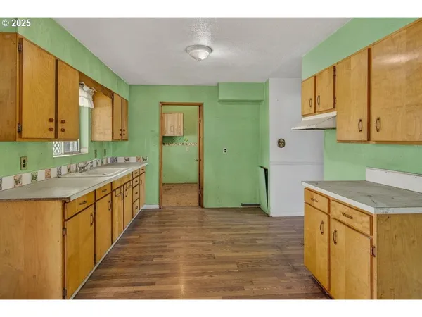 a kitchen with a sink and a refrigerator