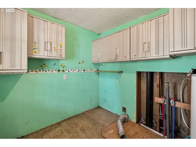 a view of a room with window and stairs