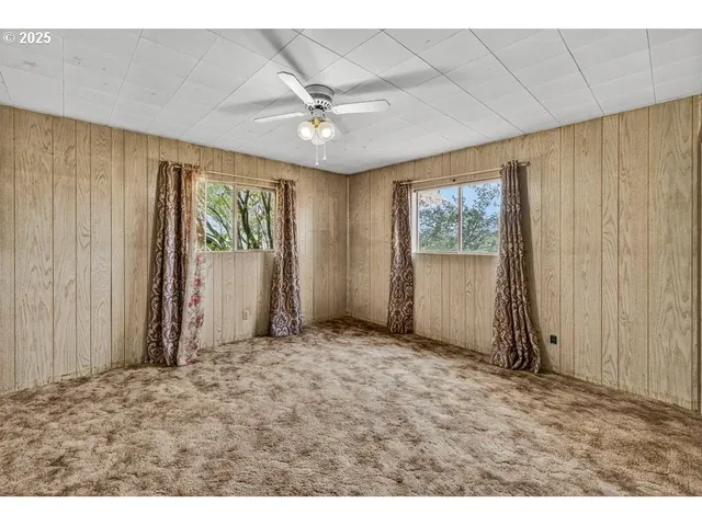 a view of empty room with windows