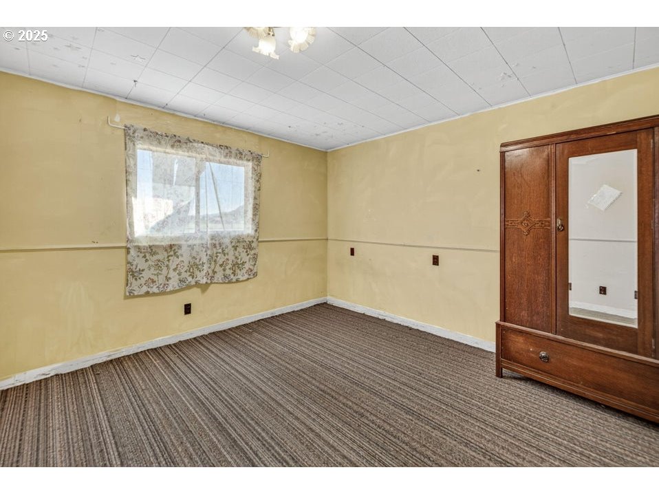 3464 Rimrock Acres Loop Prineville, OR 97754 - Photo 23 of 48 a view of an empty room with wooden floor