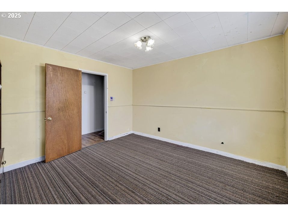 3464 Rimrock Acres Loop Prineville, OR 97754 - Photo 24 of 48 a view of an empty room with wooden floor