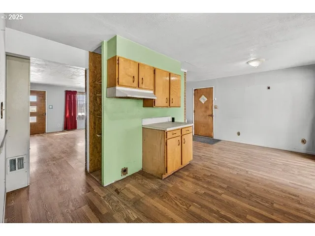 a view of kitchen with wooden floor