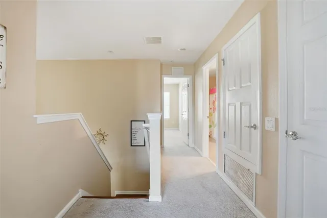 a view of a hallway with white walls