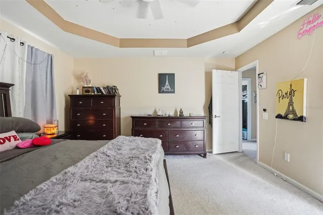 a bedroom with a bed and a dresser