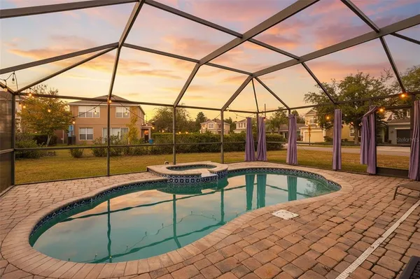 a view of a swimming pool with a porch
