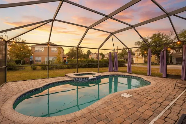 a view of a swimming pool with a porch