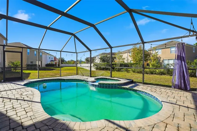 a view of a swimming pool with an outdoor seating