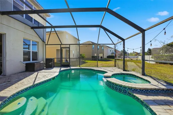 a view of a swimming pool with a backyard
