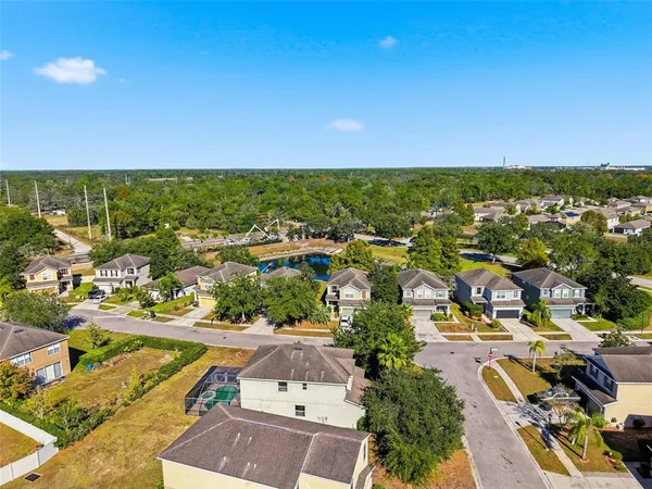 an aerial view of residential houses with outdoor space