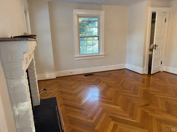 a kitchen with wooden floors and a stove