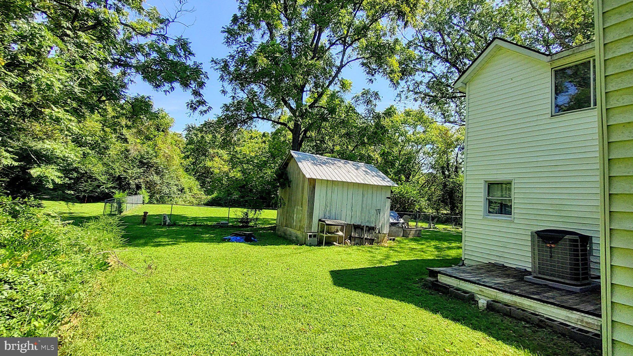 15240 Point Lookout Road St. Inigoes, MD 20684 - Photo 11 of 24 Left side yard