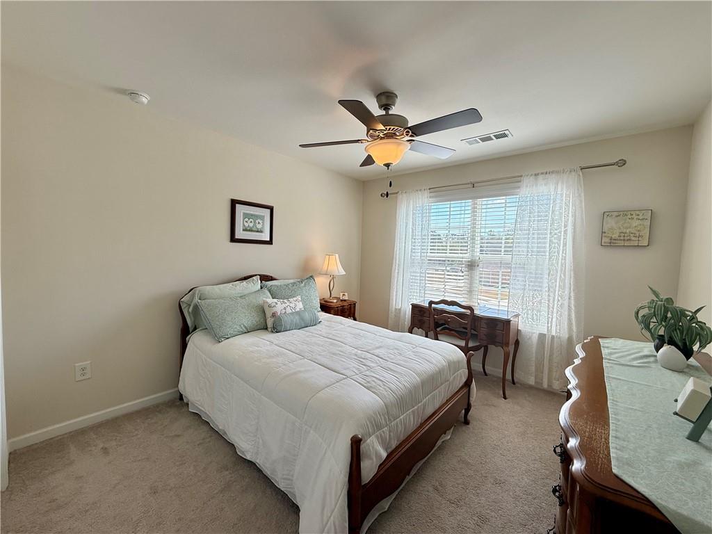 3451 Graham Way Southwest Lilburn, GA 30047 - Photo 34 of 66 a bedroom with a bed and window